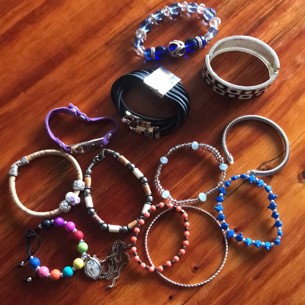 A dozen assorted costume jewelry bracelets